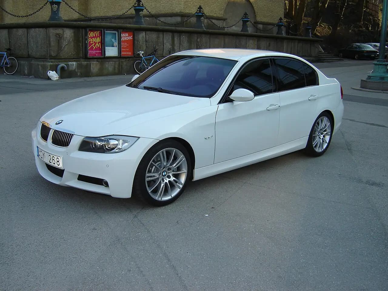 White BMW 335i M Sport sedan (E90, pre-LCI), front three-quarter view