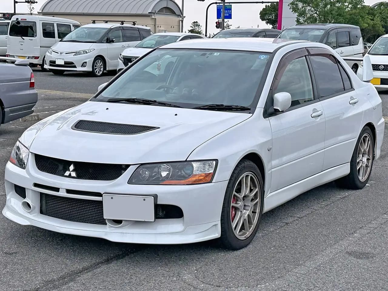 White Mitsubishi Lancer Evolution IX MR GSR (CT9A) sedan, front three-quarter view