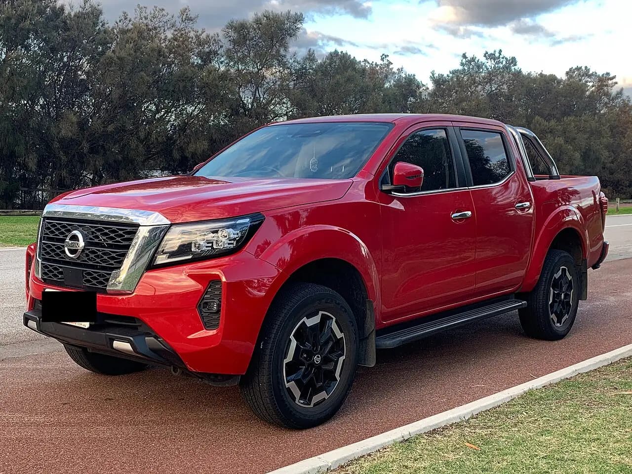 Red 2021 Nissan Navara (D23 Series 5) dual cab ute, front three-quarter view