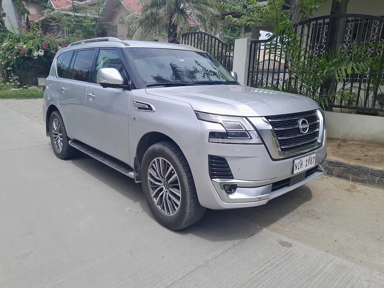 Silver 2023 Nissan Patrol (Y62 Series 5) wagon, front three-quarter view