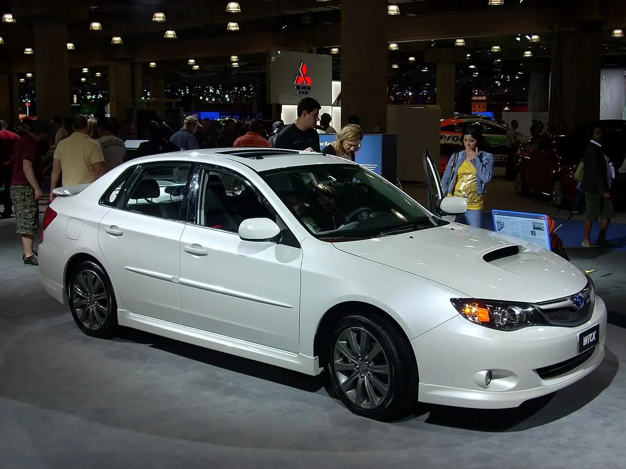 White 2009 Subaru Impreza WRX sedan (GE), front three-quarter view at a motor show