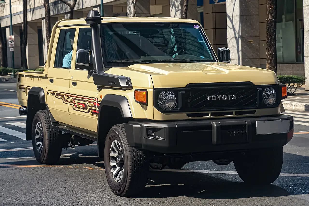 Beige Toyota LandCruiser 79 Series GDJ79 2.8 double cab (2023 facelift), front three-quarter view