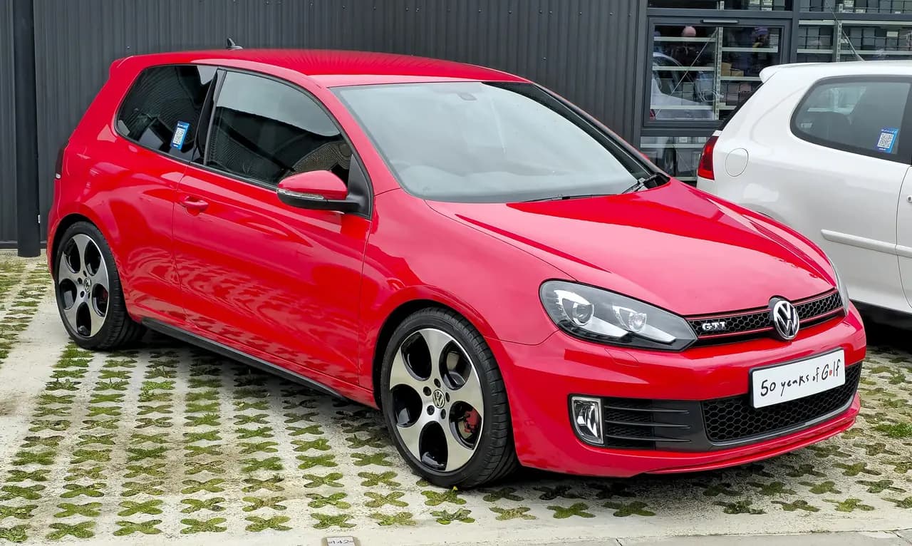 Red Volkswagen Golf GTI Mk6 3-door hatchback, front three-quarter view