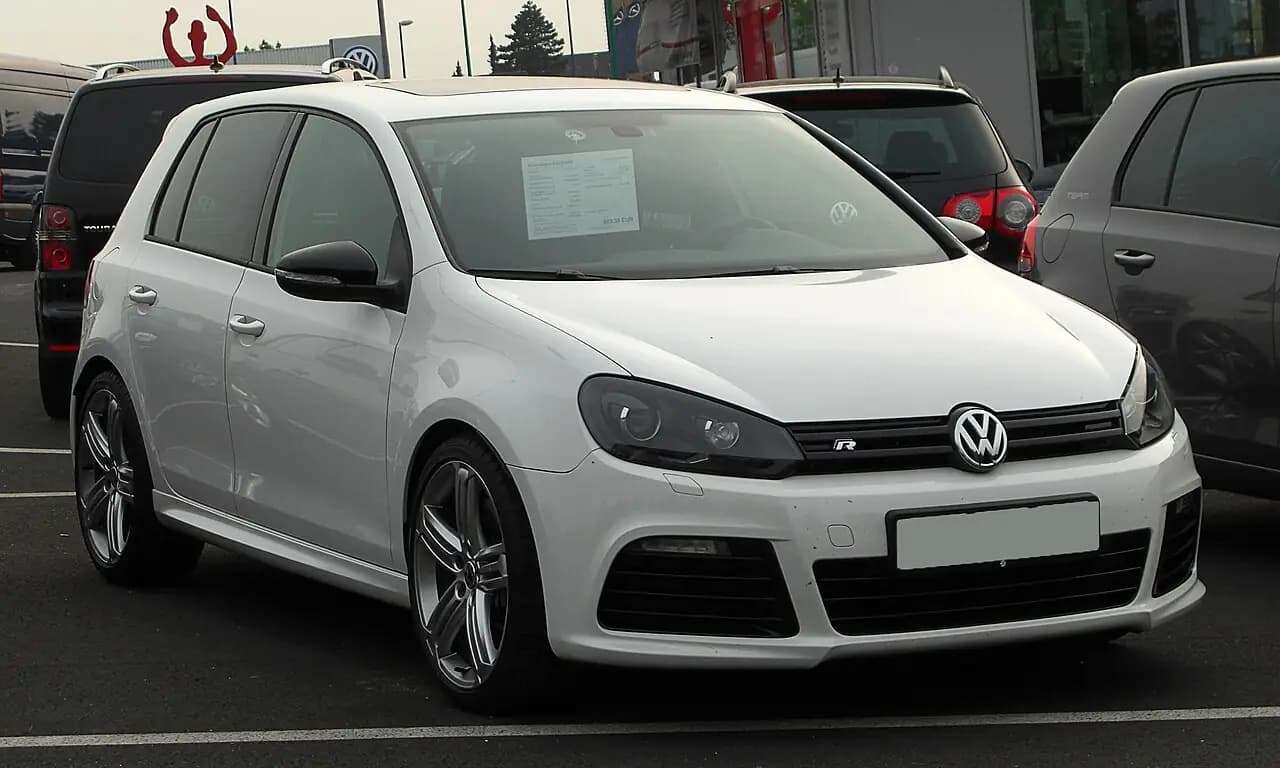 White Volkswagen Golf R (Mk6) 5-door hatchback, front three-quarter view