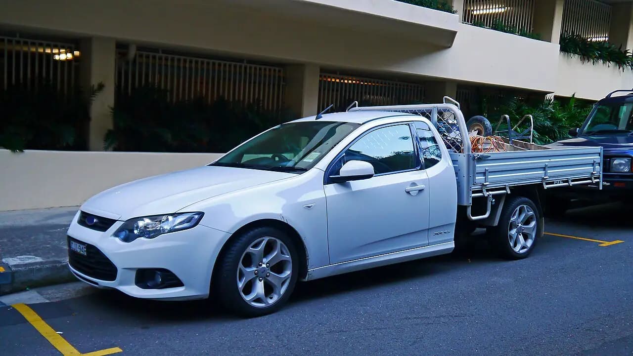 White 2012 Ford Falcon XR6 (FG II) cab-chassis ute with alloy tray, front three-quarter view