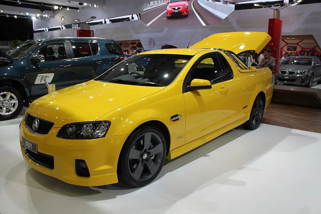 Yellow 2012 Holden Ute SS Z Series (VE Series II) at a motor show, front three-quarter view