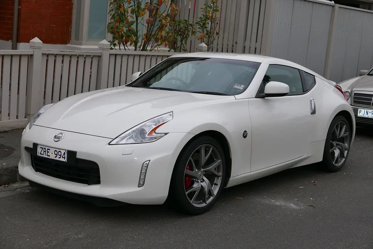 White 2013 Nissan 370Z (Z34) coupe, front three-quarter view