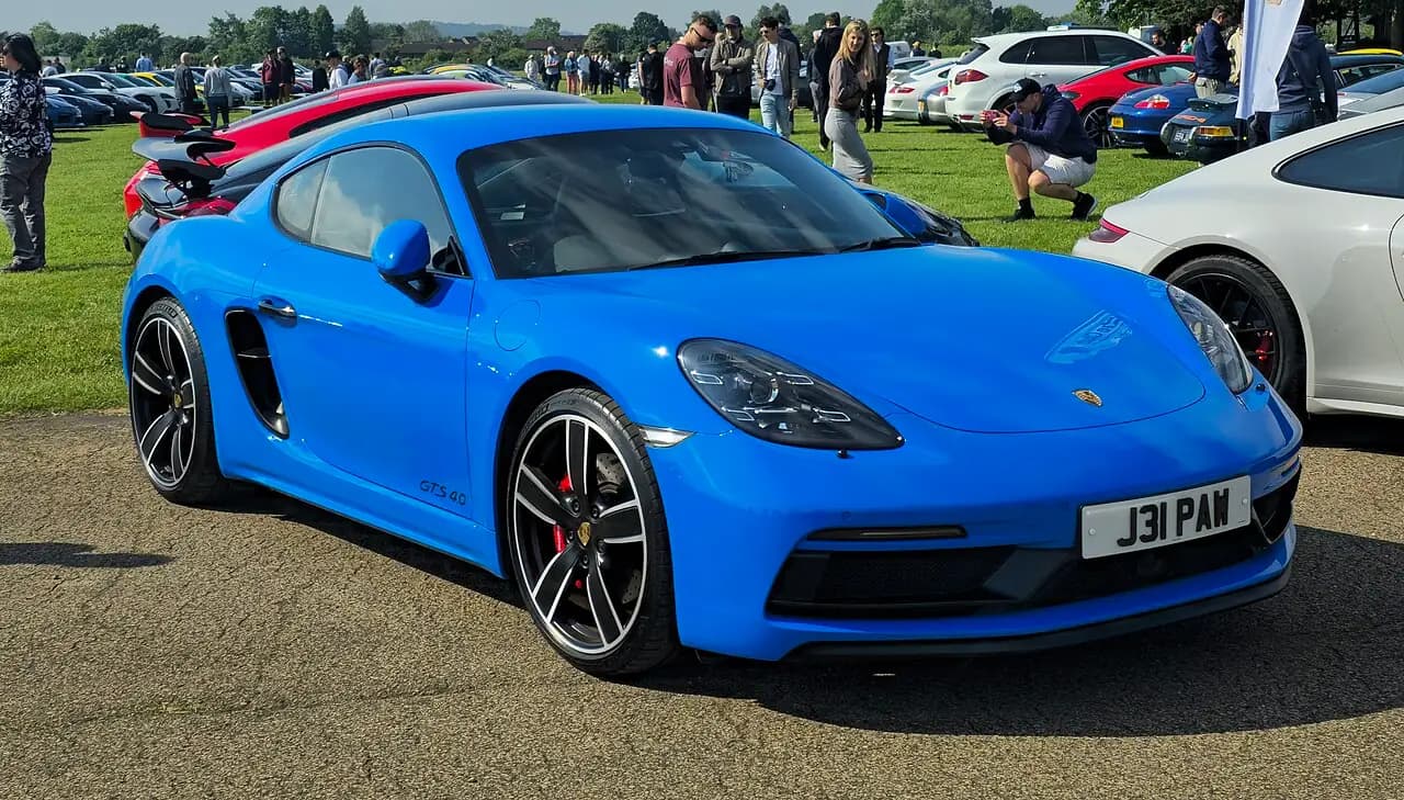 Shark Blue 2022 Porsche 718 Cayman GTS 4.0 (982), front three-quarter view